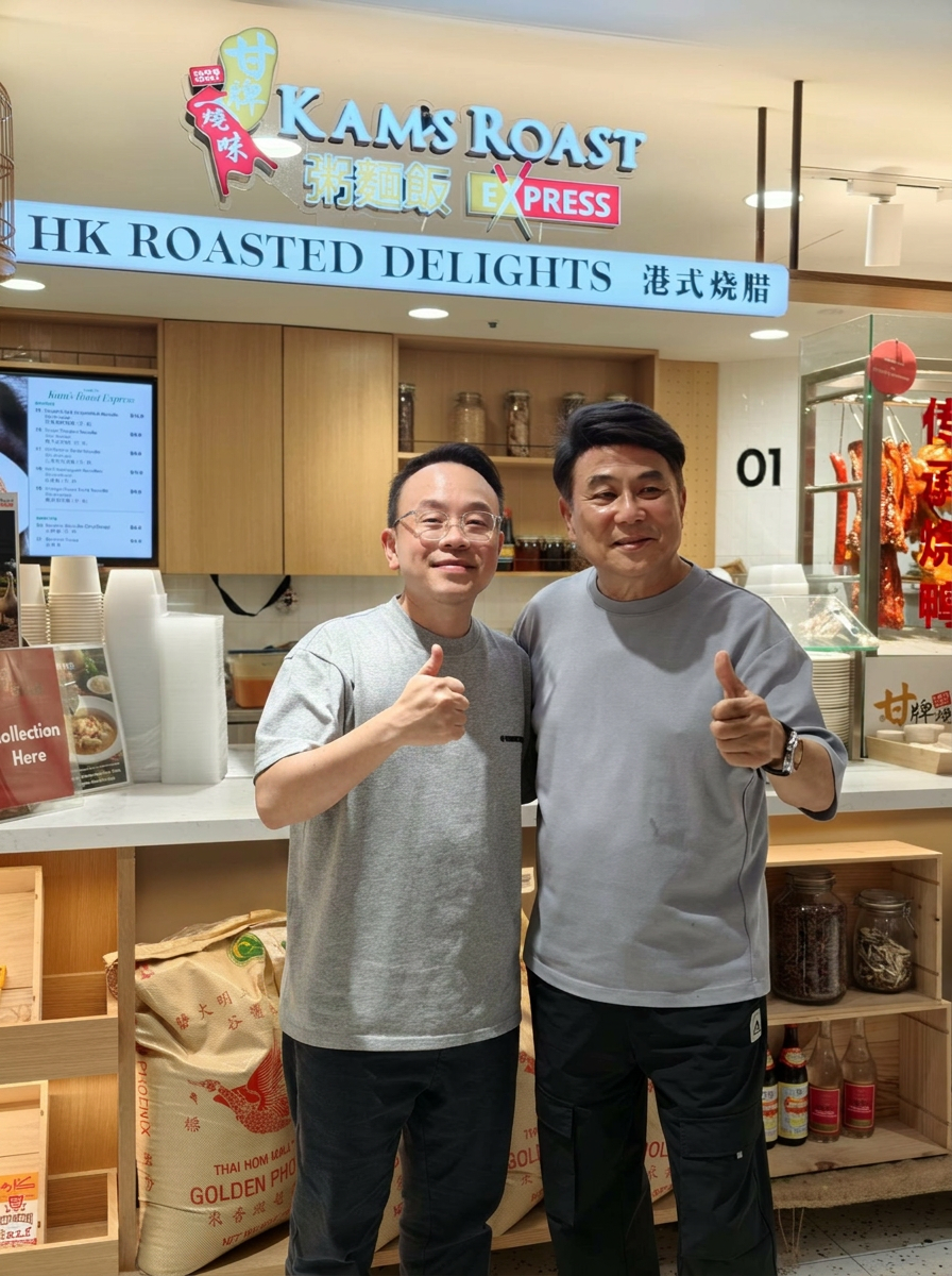 Lucas with Jack Neo at Kam's Roast Express in Singapore